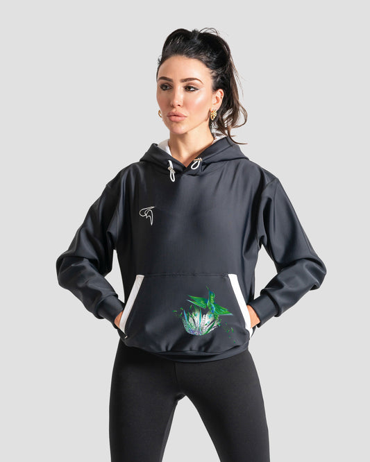 GoofyPRO Cayton XTR Hoodie in black. A graphic on front pocket of a colourful bird flying out of a colourful tree in Green seasonal colours. White embroidered logo on chest.