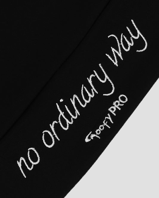 GoofyPRO Cayton Core Performance Vest in black close up of rear waistband with white embroidered 'no ordinary way' and 'GoofyPRO'.
