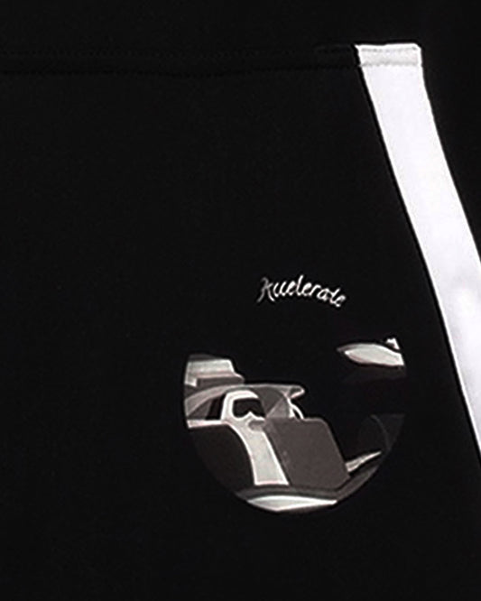 Close up of GoofyPRO Cayton Core Hoodie front pocket water based graphic of racing car and speed boat.