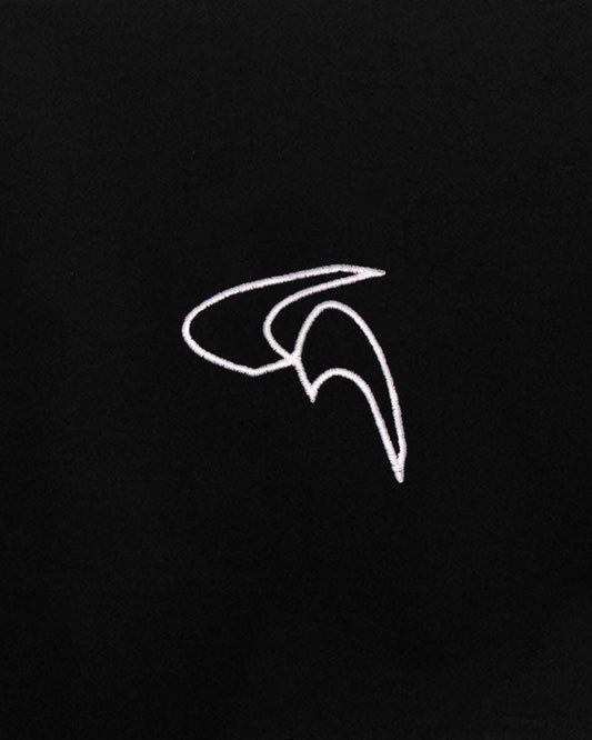 Close up of white embroidered logo on front of black Cayton Core hoodie.