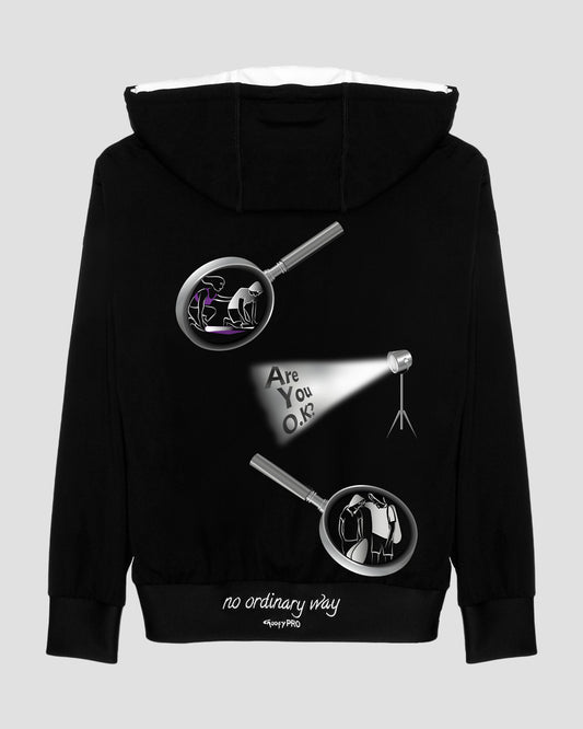 GoofyPRO Cayton Core Hoodie in black. With water based graphic design of 2 magnifying glasses with pictures and spotlight on words- Are You O.K? - Embroidered - no ordinary way