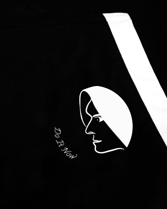 Close up of GoofyPRO Cayton Core Hoodie in black. With water based graphic design of GoofyPRO man face on front pocket.