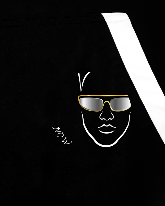 GoofyPRO Cayton XTR Hoodie in black. A close up of graphic on front pocket of silver face with gold sunglasses, words NOW in white. White pocket trim.