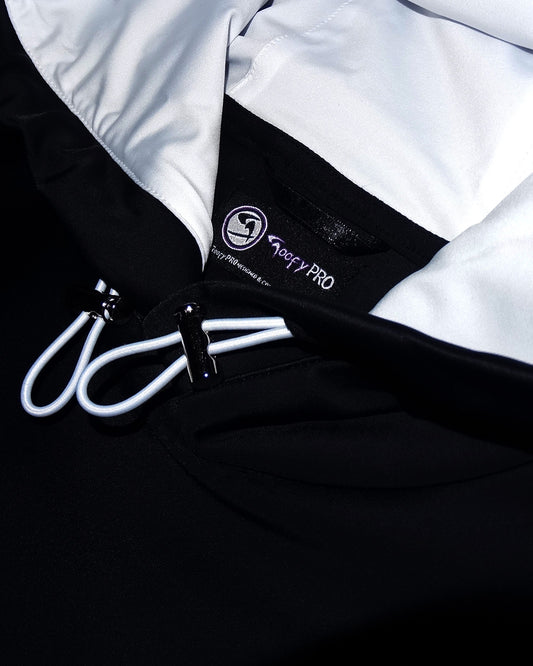 GoofyPRO Cayton XTR Black Hoodie close up of Hood, silver Toggles with white draw cord and white hood lining.