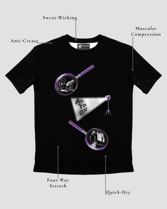 GoofyPRO Cayton Core Performance Tshirt in black with short sleeves. With water based graphic design of 2 magnifying glasses with pictures and spotlight on words- Are You O.K? - in purple, silver and white. Design elements of fabric.