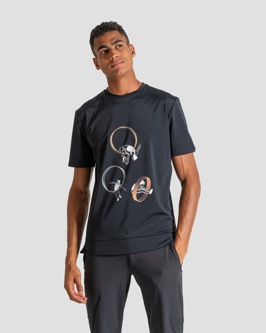 GoofyPRO Cayton Core Performance Tshirt in black with short sleeves. A graphic of 3 people completing a sport through a metallic ring. Worn by male model