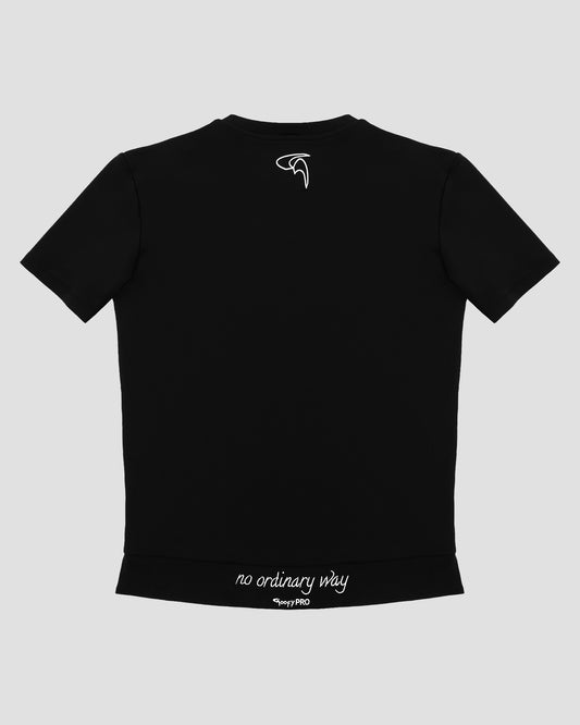 GoofyPRO Cayton Core Performance Tshirt in black with short sleeves, rear. White embroidered 'no ordinary way' in white on waistband. White embroidered logo at top of neck.