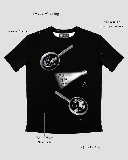 GoofyPRO Cayton Core Performance Tshirt in black with short sleeves. A graphic of two magnifying glasses with a spotlight asking Are You O.K? Design elements of the T-shirt showing.