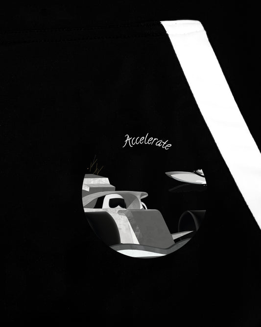 Close up of GoofyPRO Accelerate Cayton Core Hoodie graphic. A racing car and a speedboat on a black hoodie with white pocket trims.