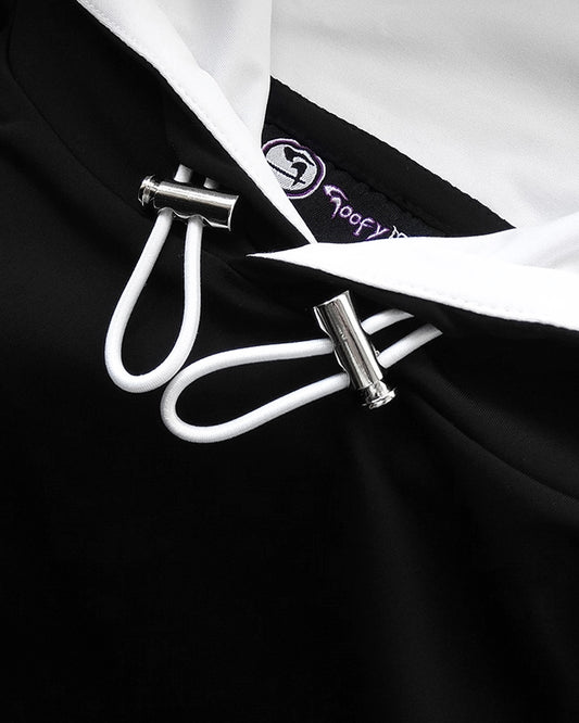 Close up of silver looking toggles on hood of front of Cayton Core Black Hoodie.