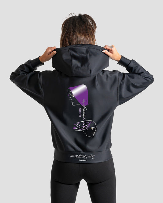 GoofyPRO Cayton XTR Hoodie in black. A graphic on rear of two faces in purple, silver and white with Do It NOW no ordinary way writing. no ordinary way in white embroidery on waistband.