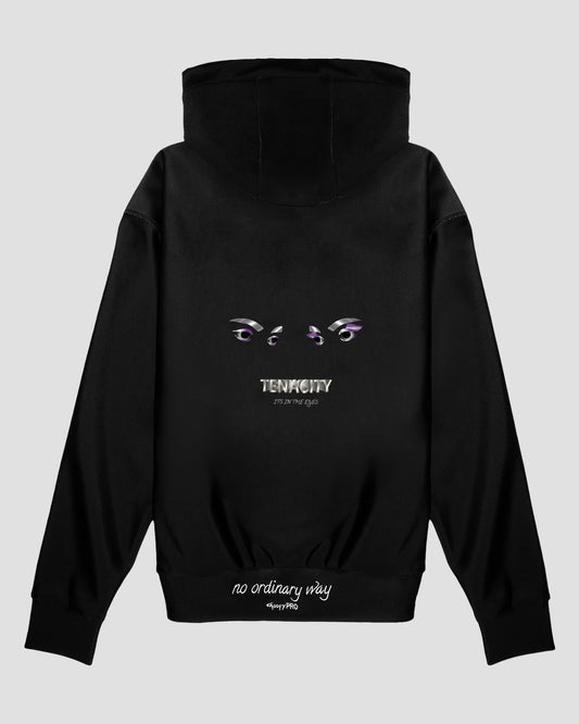 GoofyPRO Cayton XTR Hoodie in black. A graphic on rear of two eyes with TENACITY It's in the Eyes in white, purple, silver and flecks of gold. White embroidered 'no ordinary way' on waistband.