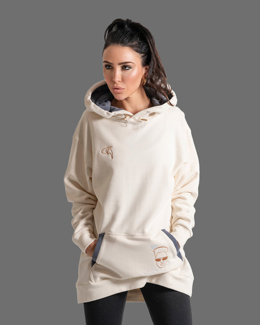 GoofyPRO Daymer fleece hoodie in cream with Rose Gold embroidery logo on chest and Rose Gold and White embroidery on pocket. Grey fleece pocket detailing and hood lining. Worn by female model