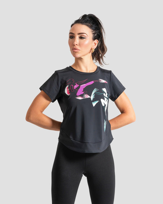 GoofyPRO Cayton Core Performance Tshirt in black with short sleeves. A graphic of a female and male in martial art style pose. worn by female model